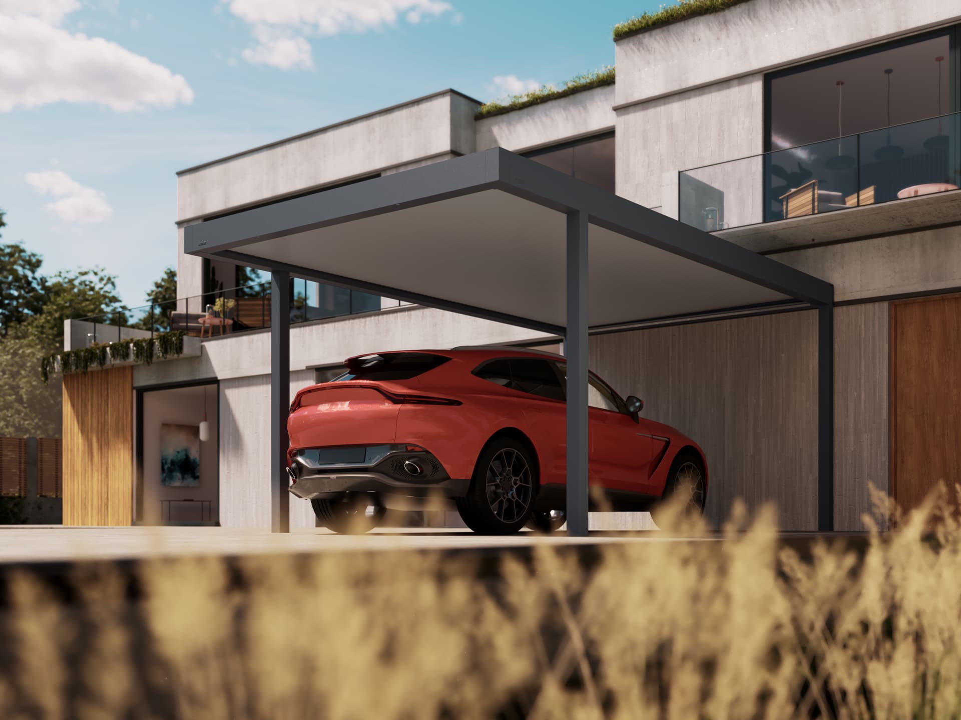 Moderne witte kubuswoning met plat dak, voorzien van een terras met pergola en een bijpassende vrijstaande aluminium carport.