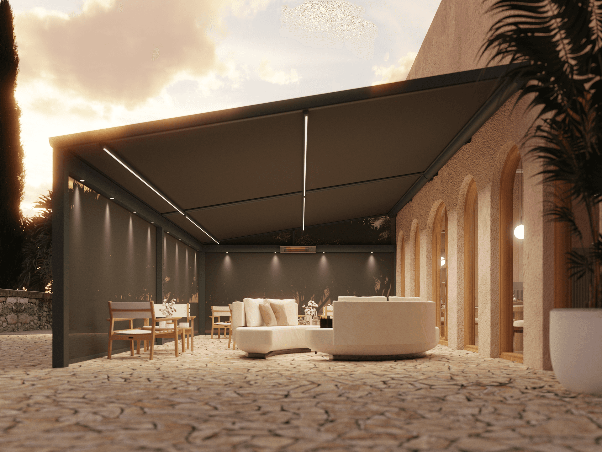 Aluminium B128 XL‑pergola met volledig uitgerold doekdak en geïntegreerde LED‑lijnen die een warme lounge‑ en eethoek bij zonsondergang creëren